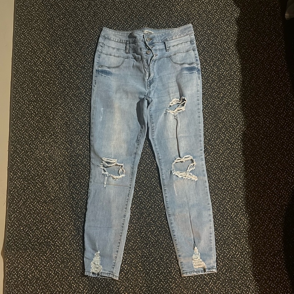 High wasted refuge size 12 distressed light washed jeans with holes
